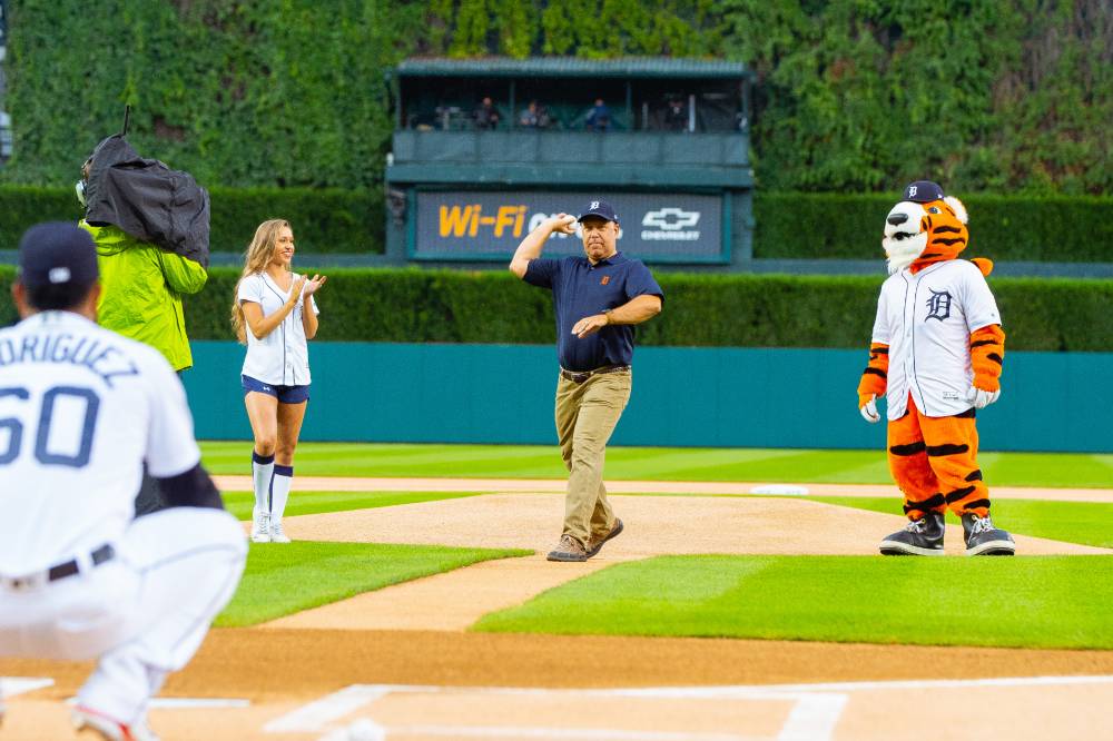 Man throwing pitch next to Detroit Tigers mascot pt. 2